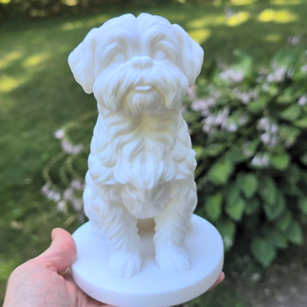 A real finished pet statue held in one hand
